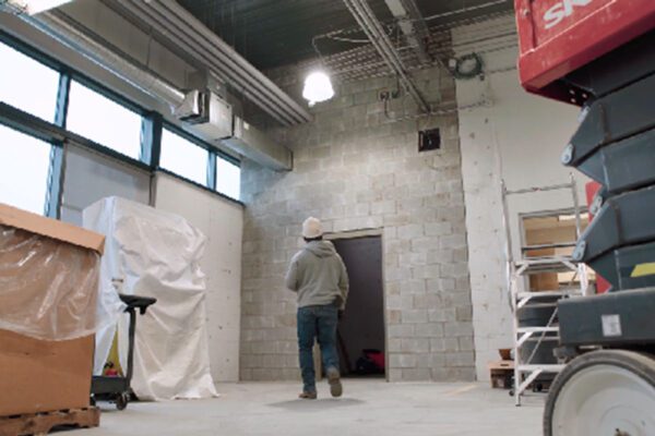 Unfinished industrial space with concrete block walls made using Resin8, showcasing practical e‑waste solutions for high‑end infrastructure applications globally.