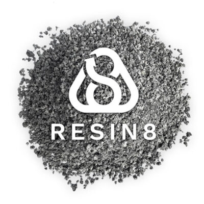 Resin8 logo displayed over recycled aggregate material, representing circular e‑waste solutions.