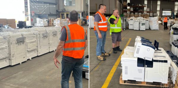 Warehouse with large printers and copiers stacked on pallets for recycling, showcasing soft plastic and hard plastic circularity processes in Australia as part of sustainable e-waste management.