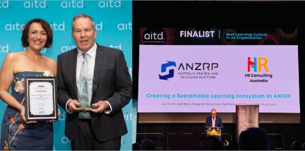 ANZRP team receiving AITD Best Learning Culture award on stage