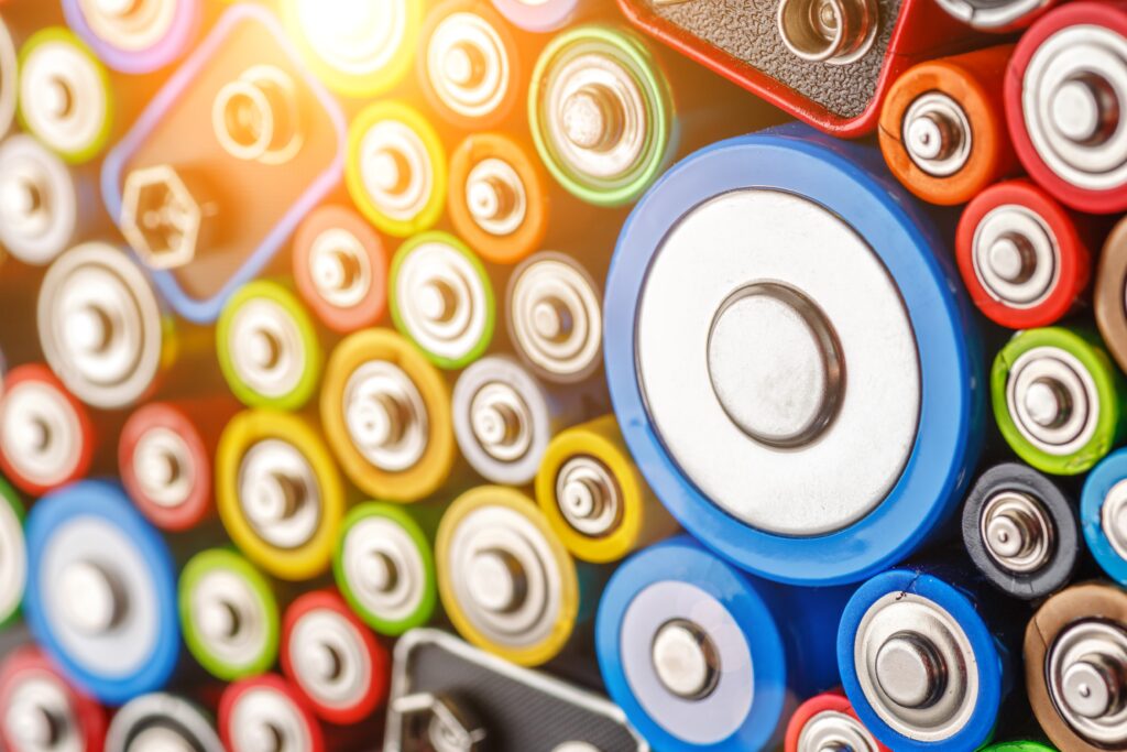 Close-up of used batteries of various sizes and colours collected for recycling and responsible resource recovery. Battery Recycling and Resource Recovery
